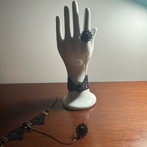 Set of 2 decorative cuff, ring set.
Black, matte metal, fabric.